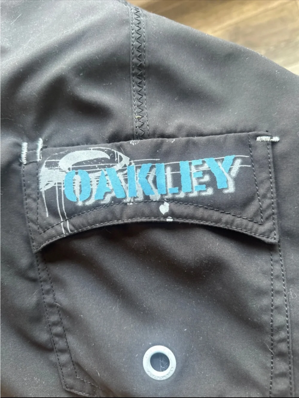 06 vintage Oakley Black Board Shorts with Blue Graphic Accents